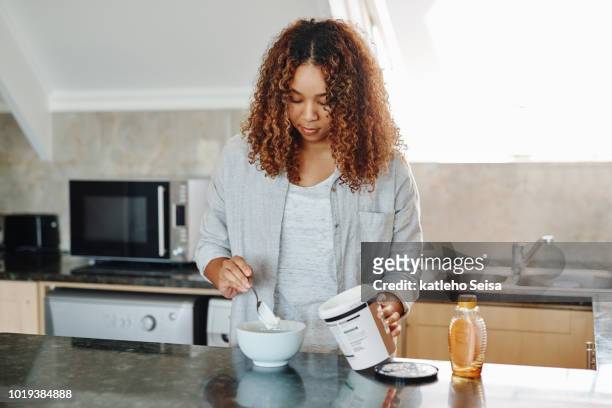 getting ready for the day - women yogurt stock pictures, royalty-free photos & images