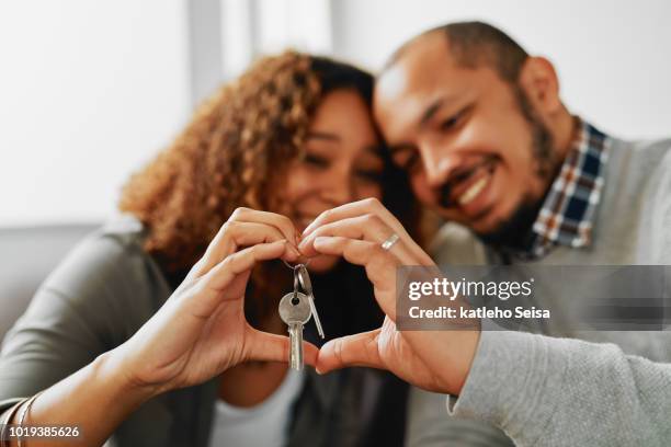 they have the key to each others hearts - making heart shape stock pictures, royalty-free photos & images