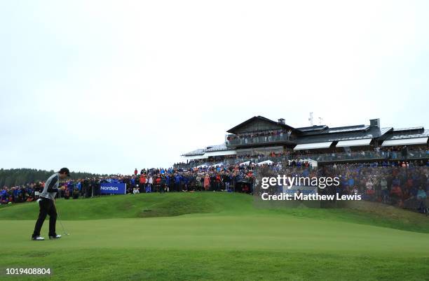 Thomas Aiken of South Africa celebrates a putt to make the play off, on the 18th green during day four of the Nordea Masters at Hills Golf Club on...