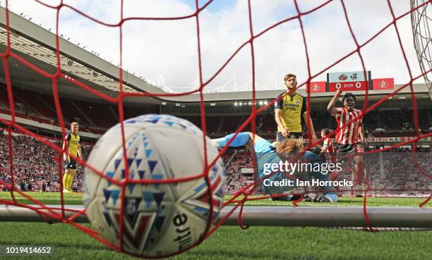 Scunthorpe keeper Rory Watson can't stop Max Power of Sunderland breaking the deadlock, heading in the first goal during the Sky Bet League One match...