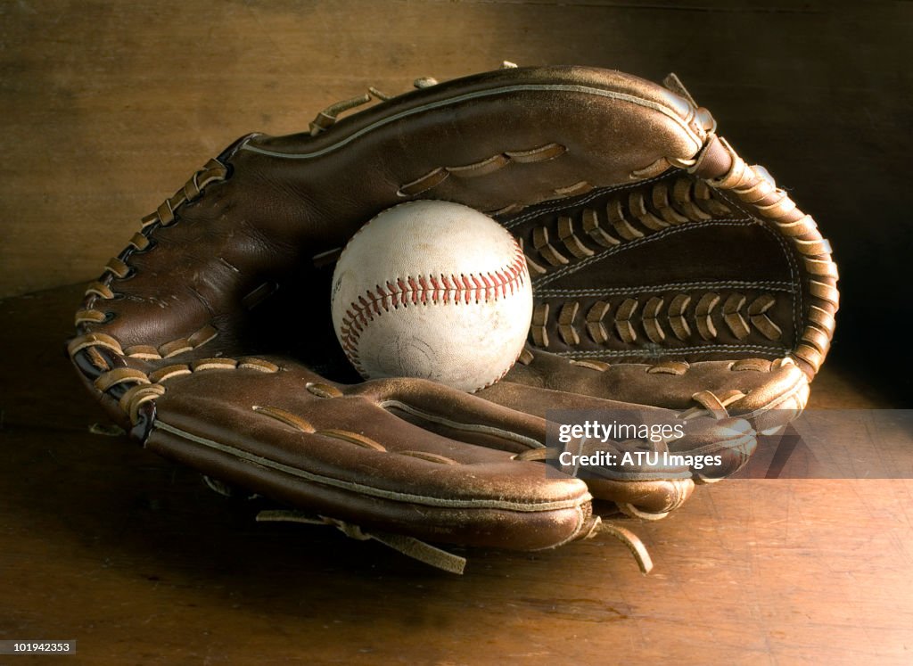 Baseball glove on wood