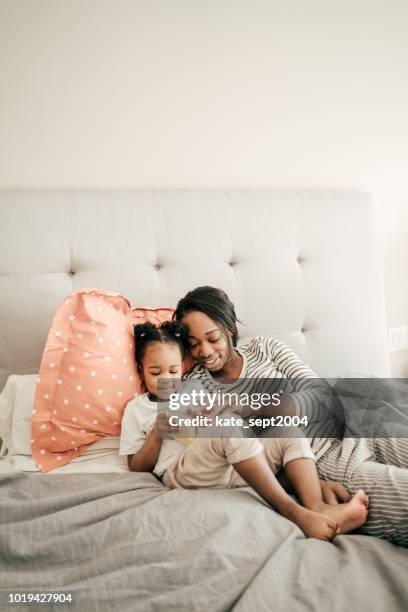 reading and learning at home - bedtime stock pictures, royalty-free photos & images