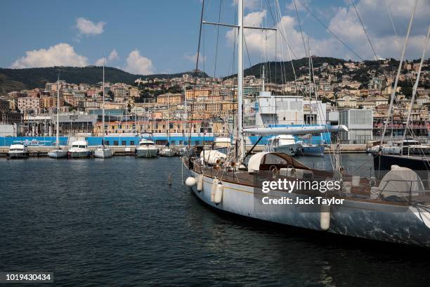 Boats sit docked in the Port of Genoa on August 19, 2018 in Genoa, Italy. 43 people were killed after a large section of the Morandi highway bridge...