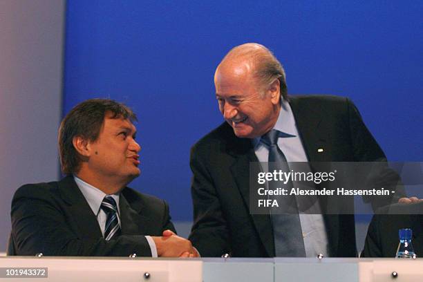 President Joseph S. Blatter talks to FIFA executive member Reynald Temarii of Tahiti prior to the 60th FIFA Congress at Sandton Convention Center on...