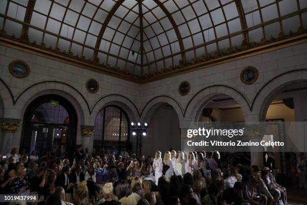 Models walk the runway at the Line of Oslo show during Oslo Runway SS19 at Bankplassen 4 on August 15, 2018 in Oslo, Norway.