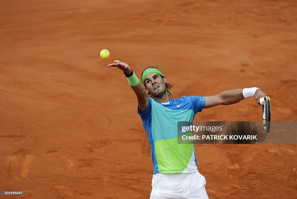 Spain's Rafael Nadal serves to Sweden's