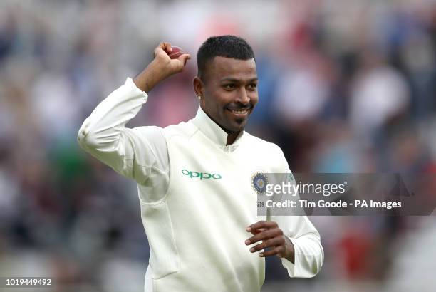 India's Hardik Pandya walks off with the ball before tea after taking five wickets during day two of the Specsavers Third Test match at Trent Bridge,...
