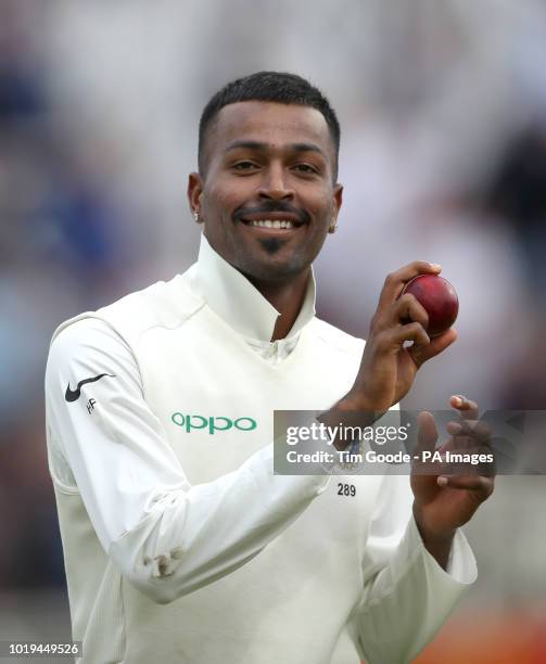 India's Hardik Pandya walks off with the ball before tea after taking five wickets during day two of the Specsavers Third Test match at Trent Bridge,...