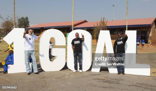 Football legends Socrates , Andrew Cole and Quinton Fortune visit the 1GOAL School at Winnie Ngwezi Primary school on June 10, 2010 in Johannesburg,...