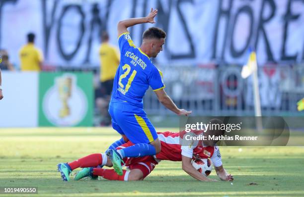 August 19: Dennis Slamar of FC Carl-Zeiss Jena and Felix Kroos of 1 FC Union Berlin during the game between FC Carl Zeiss Jena and Union Berlin at...