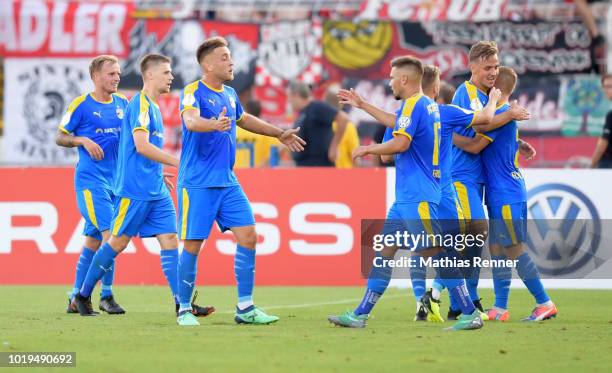 August 19: Rene Eckardt, Dominik Bock, Dennis Slamar, Niclas Erlbeck, Marius Groesch and Florian Bruegmann of FC Carl-Zeiss Jena celebrate after...