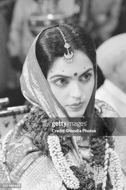 Nita Ambani at her wedding to Indian billionaire industrialist Mukesh Ambani, Mumbai, India, circa 1985.