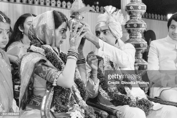 Nita Ambani and Indian billionaire industrialist Mukesh Ambani at their wedding ceremony, Mumbai, circa 1985.
