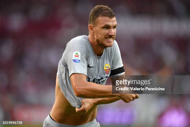 Edin Dzeko of AS Roma celebrates after scoring the opening goal during the Serie A match between Torino FC and AS Roma at Stadio Olimpico di Torino...