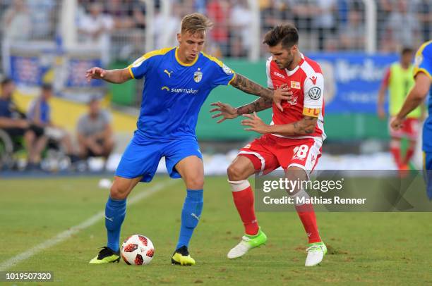 Phillip Tietz of FC Carl-Zeiss Jena and Christopher Trimmel of 1 FC. Union Berlin during the game between FC Carl Zeiss Jena and Union Berlin at the...