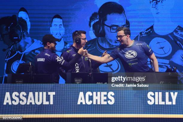 Adam 'Assault' Garcia, Patrick 'Aches' Price and Justin 'Silly' Fargo, all of Evil Geniuses, celebrate after defeating Team Kaliber to advance to the...