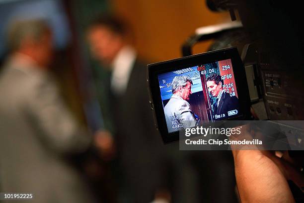 Treasury Secretary Timothy Geithner and Senate Finance Committee Chairman Max Baucus are seen on a television camera viewfinder at the conclusion of...