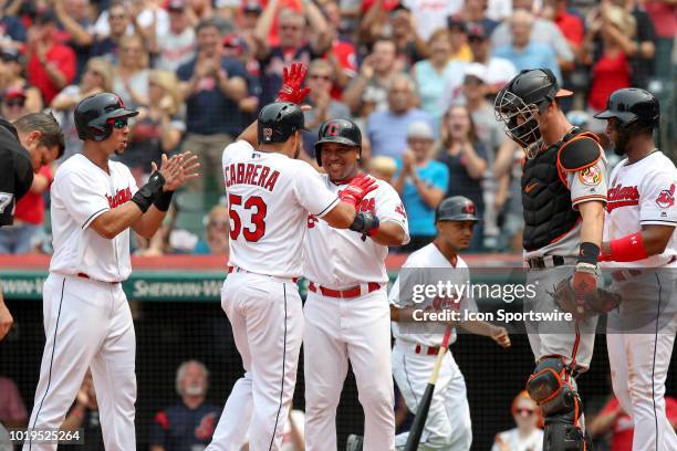 Cleveland Indians outfielder Melky Cabrera is greeted by Cleveland Indians left fielder Michael Brantley , Cleveland Indians third baseman Jose...