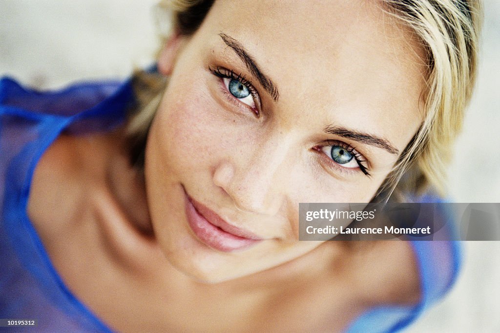 Young woman looking up, portrait, close-up