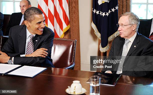 President Barack Obama jokes with Sen. Harry Reid during a meeting with congressional leaders in the cabinet room at the White House June 10, 2010 in...
