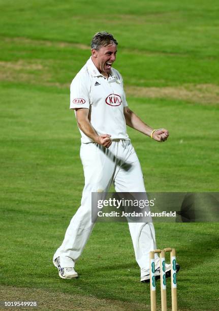 Rikki Clarke of Surrey celebrates dismissing Matthew Parkinson of Lancashire during day one of the Specsavers County Championship Division One match...
