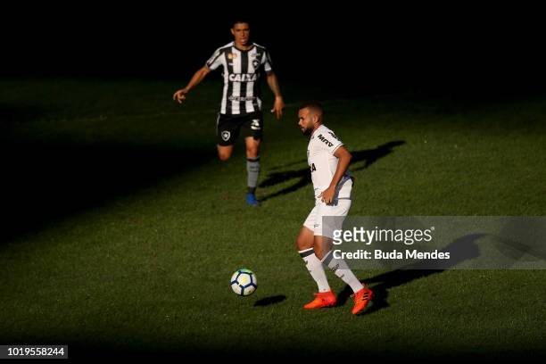 Renatinho of Botafogo struggles for the ball with Jose Welison of Atletico during a match between Botafogo and Atletico MG as part of Brasileirao...
