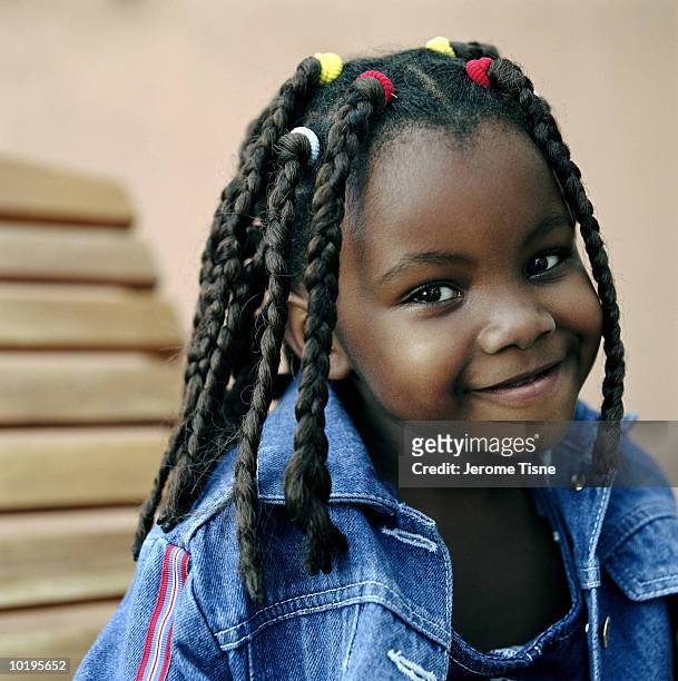 girl (4-6) with braided hair, portrait - braided hairstyles for african american girls stock pictures, royalty-free photos & images