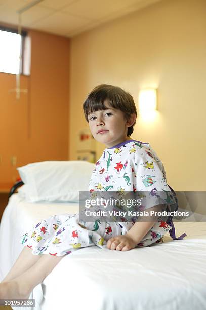 portrait of boy in examing room at hospital - examination gown stock pictures, royalty-free photos & images