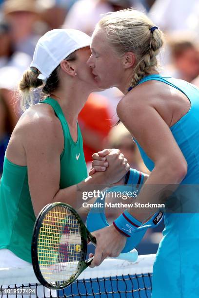 Simona Halep of Romania congratulates Kiki Bertens of Netherlands after their match during the women's final of the Western & Southern Open at...