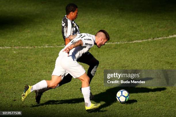 Bochecha of Botafogo struggles for the ball with Nathan of Atletico during a match between Botafogo and Atletico MG as part of Brasileirao Series A...