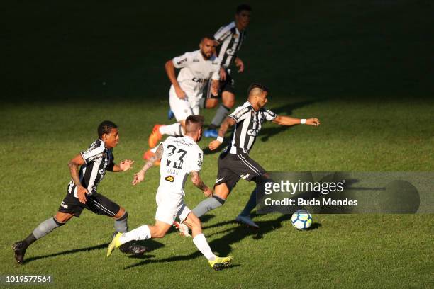 Bochecha and Brenner of Botafogo struggle for the ball with Nathan of Atletico during a match between Botafogo and Atletico MG as part of Brasileirao...