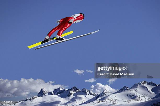 downhill skier jumping, rear view (digital composite) - salto con gli sci foto e immagini stock