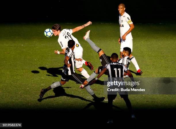 Brenner of Botafogo struggles for the ball with Iago Maidana of Atletico during a match between Botafogo and Atletico MG as part of Brasileirao...