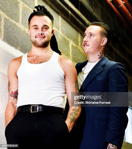 Isaac Holman and Laurie Vincent of Slaves pose backstage after performing live and signing copies of their new album 'Acts of Fear and Love' during...