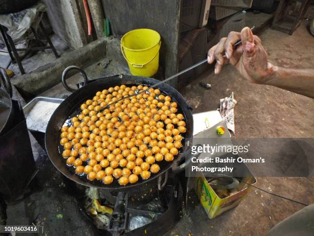 life going around streets of the city - gulab jamun stock pictures, royalty-free photos & images