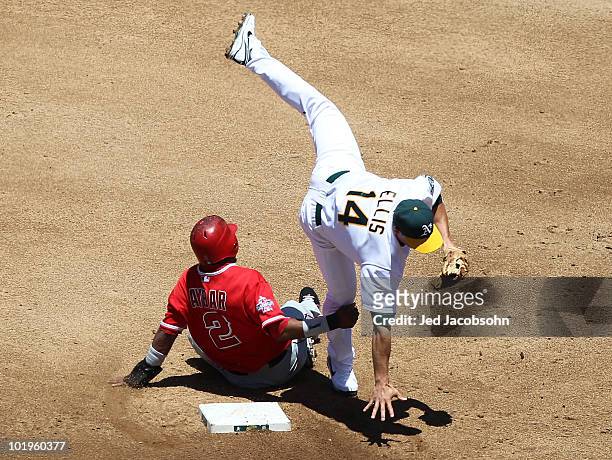 Mark Ellis of the Oakland Athletics is upended by Erick Aybar of the Los Angeles Angels of Anaheim on a double play hit by Howie Kendrick in the...