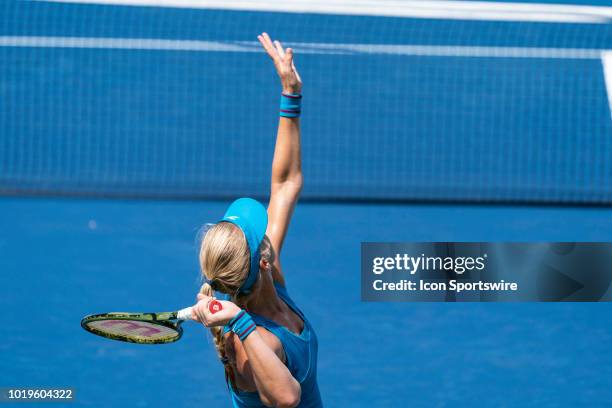 Kiki Bertens of the Netherlands serves the ball to Simona Halep of Romania during the women's final on Day 8 of the Western and Southern Open at the...