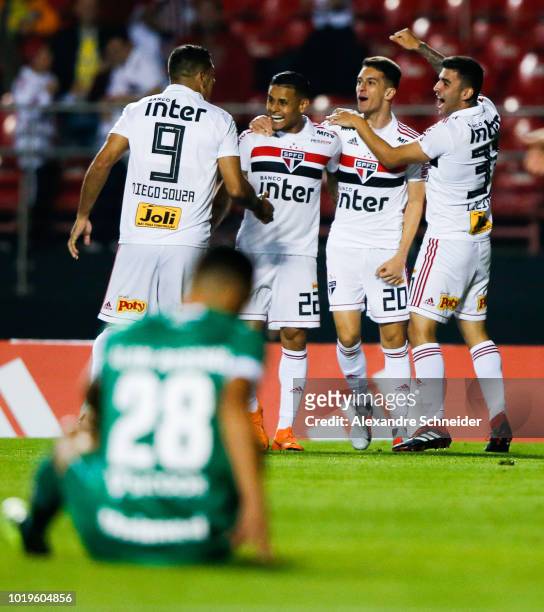 Shaylon of Sao Paulo celebrates with teammates after scoring the first goal of his team during the match against Chapecoense for the Brasileirao...