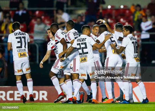 Shaylon of Sao Paulo celebrates with teammates after scoring the first goal of his team during the match against Chapecoense for the Brasileirao...
