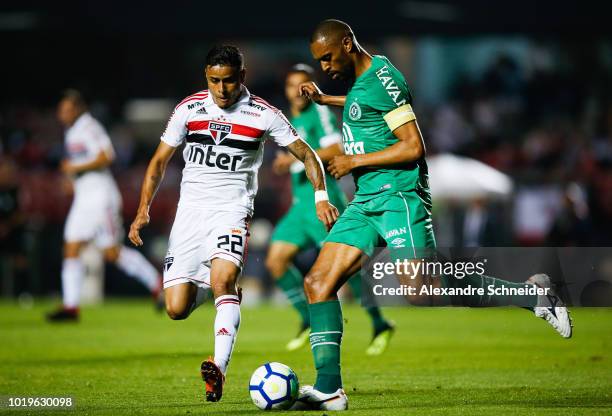 Everton of Sao Paulo and Douglas of Chapecoense competes for the ball during the match for the Brasileirao Series A 2018 at Morumbi Stadium on August...