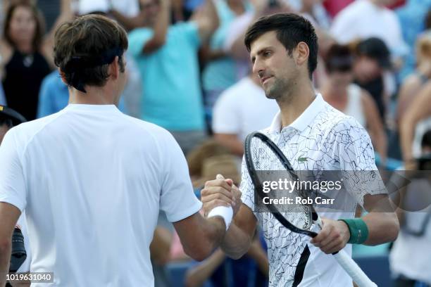 Novak Djokovic of Serbia shakes hands with Roger Federer of Switzerland after winning the mens final during Day 9 of the Western and Southern Open at...