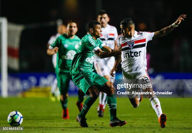 Marcio Araujo of Chapecoense and Everton of Sao Paulo competes for the ball during the match for the Brasileirao Series A 2018 at Morumbi Stadium on...
