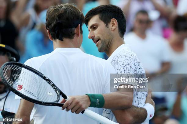 Novak Djokovic of Serbia shakes hands with Roger Federer of Switzerland after winning the mens final during Day 9 of the Western and Southern Open at...