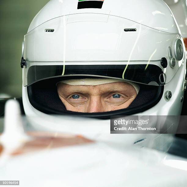 racing driver in car, close-up - pilota di auto da corsa foto e immagini stock