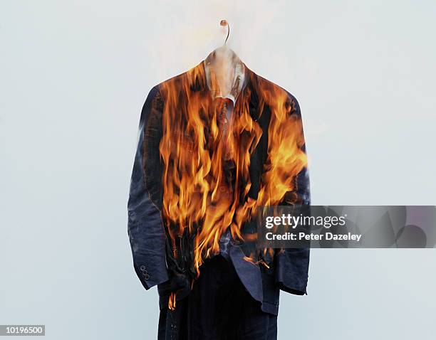 suit on hanger burning - clothes on fire stock pictures, royalty-free photos & images