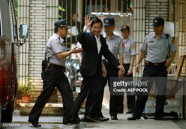 Taiwan's former president Chen Shui-bian waves as he arrives for the ruling in his appeal against a life sentence for corruption at Taiwan's high...