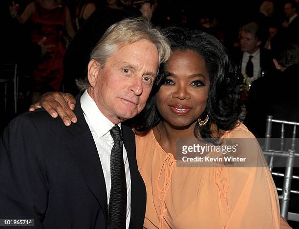 Actor Michael Douglas and Oprah Winfrey pose in the audience during the 38th AFI Life Achievement Award honoring Mike Nichols held at Sony Pictures...
