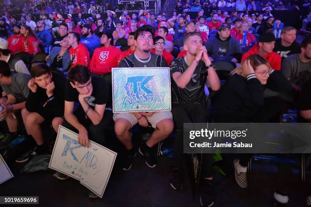 Fans of Team Kaliber look on in disappointment as TK begins to lose a competition against Evil Geniuses in the Grand Finals of the 2018 Call of Duty...