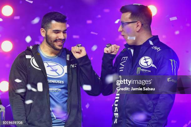 Bryan 'Apathy' Zhelyazkov and Patrick 'Aches' Price, both of Evil Geniuses, admire their rings after winning the World Championship during the 2018...