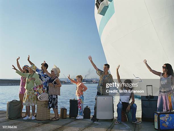 group of people by ship waving goodbye - family waving stock pictures, royalty-free photos & images